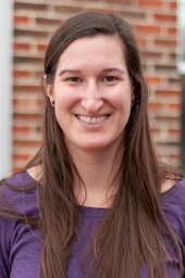 A headshot of Paige Fletcher in a purple shirt.