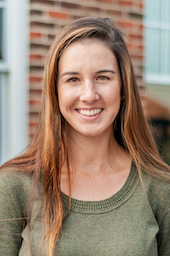 A headshot of Cecilia Prator in a green shirt.
