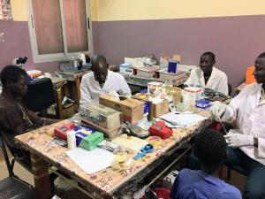 Photo of Malian collaborators draw blood from participants of malaria clinical trials in Kalifaboubou, Mali.