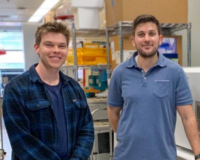 Marc Theberge and Mohammad Abu-Laban, M.S., Ph.D. in a laboratory.