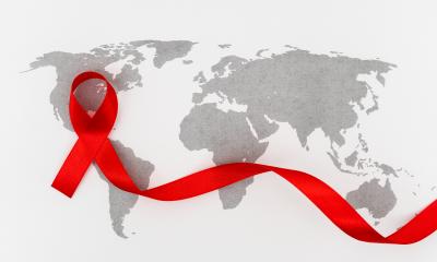 a world map and red HIV ribbon