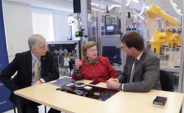 NIH Director Francis S. Collins and NCATS Director Christopher P. Austin talk with U.S. Senator Barbara A. Mikulski