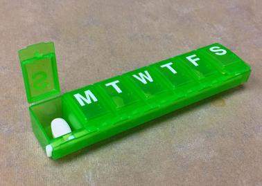 Pill box containing antiretroviral therapy for HIV.