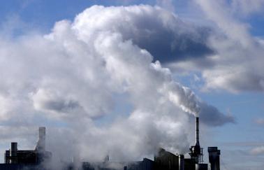 Photo of air emissions at an urban manufacturing complex.