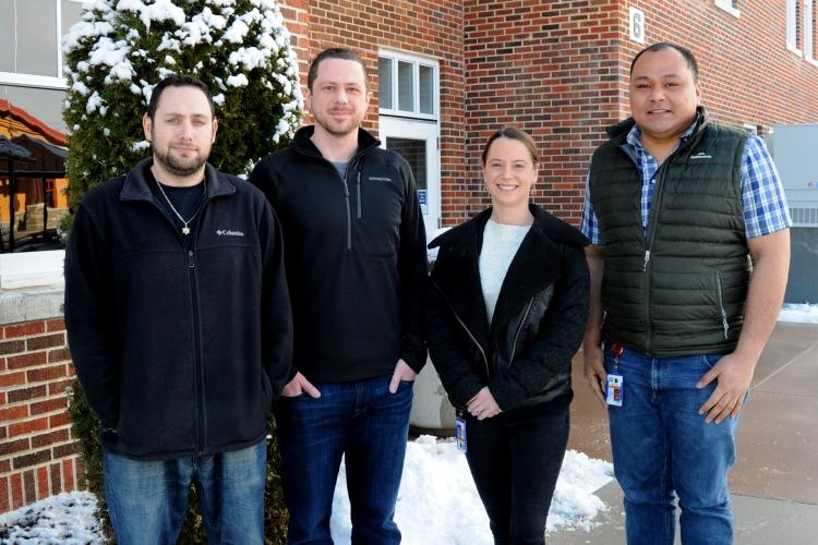Bradley Groveman, Ryan Walters, Cathryn Haigh, and Simote Foliaki pose for a photo