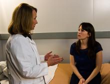 A doctor speaks with her patient.