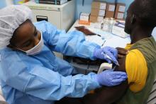 Study volunteer receives an inoculation at Redemption Hospital in Monrovia, Liberia on the opening day of PREVAC, a Phase 2 Ebola vaccine trial in West Africa