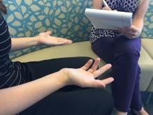 A counselor listens to and advises a client. 