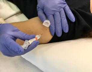 Universal Flu Vaccine Trial Volunteer Receives Injection