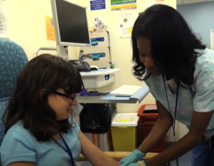 PASLI/APDS patient with nurse at NIH