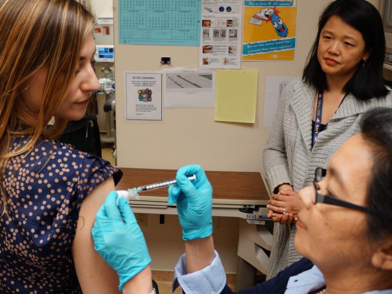 volunteer receives an experimental universal influenza vaccine